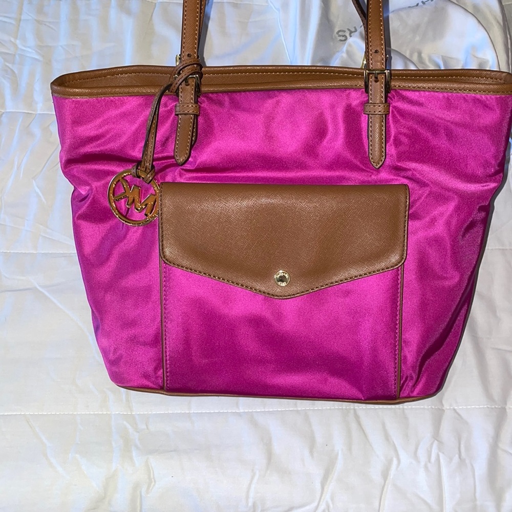 Michael Kors hot pink work bag.